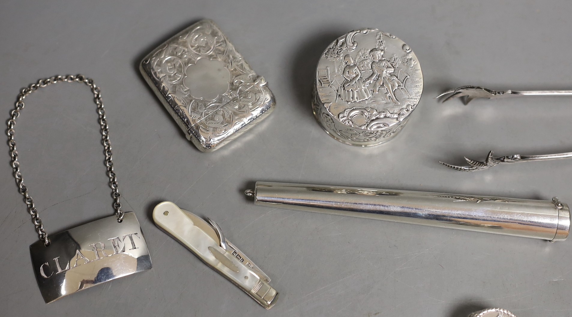 A 9ct gold cased propelling toothpick and nine other small silver or white metal items including pill box, handbag mirror, tongs, fruit knife etc.